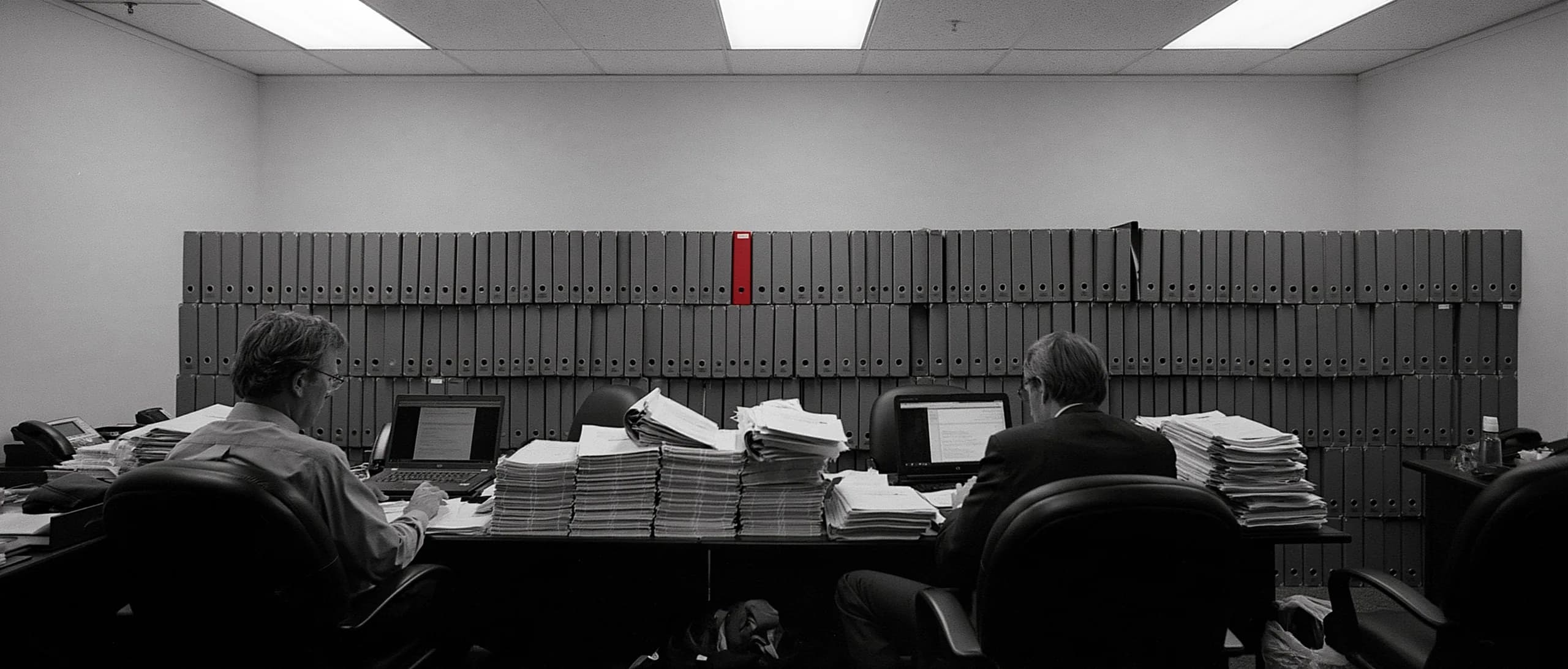 Analysts working through diligence documents in a data room